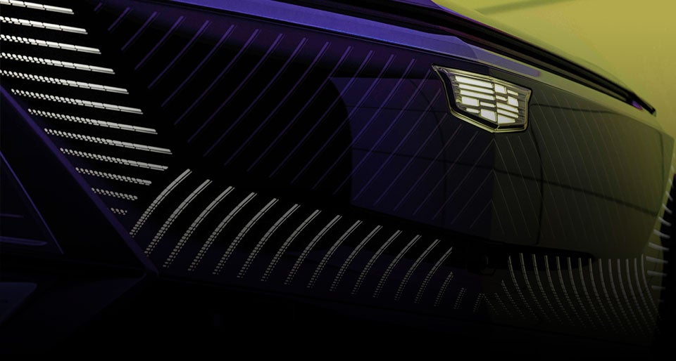 Close-up of the Cadillac Lyriq grille and logo, showcasing its bold and distinctive design