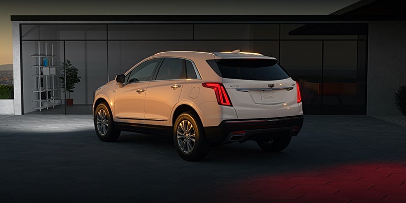 White Cadillac XT5 parked, showcasing its sleek and elegant design